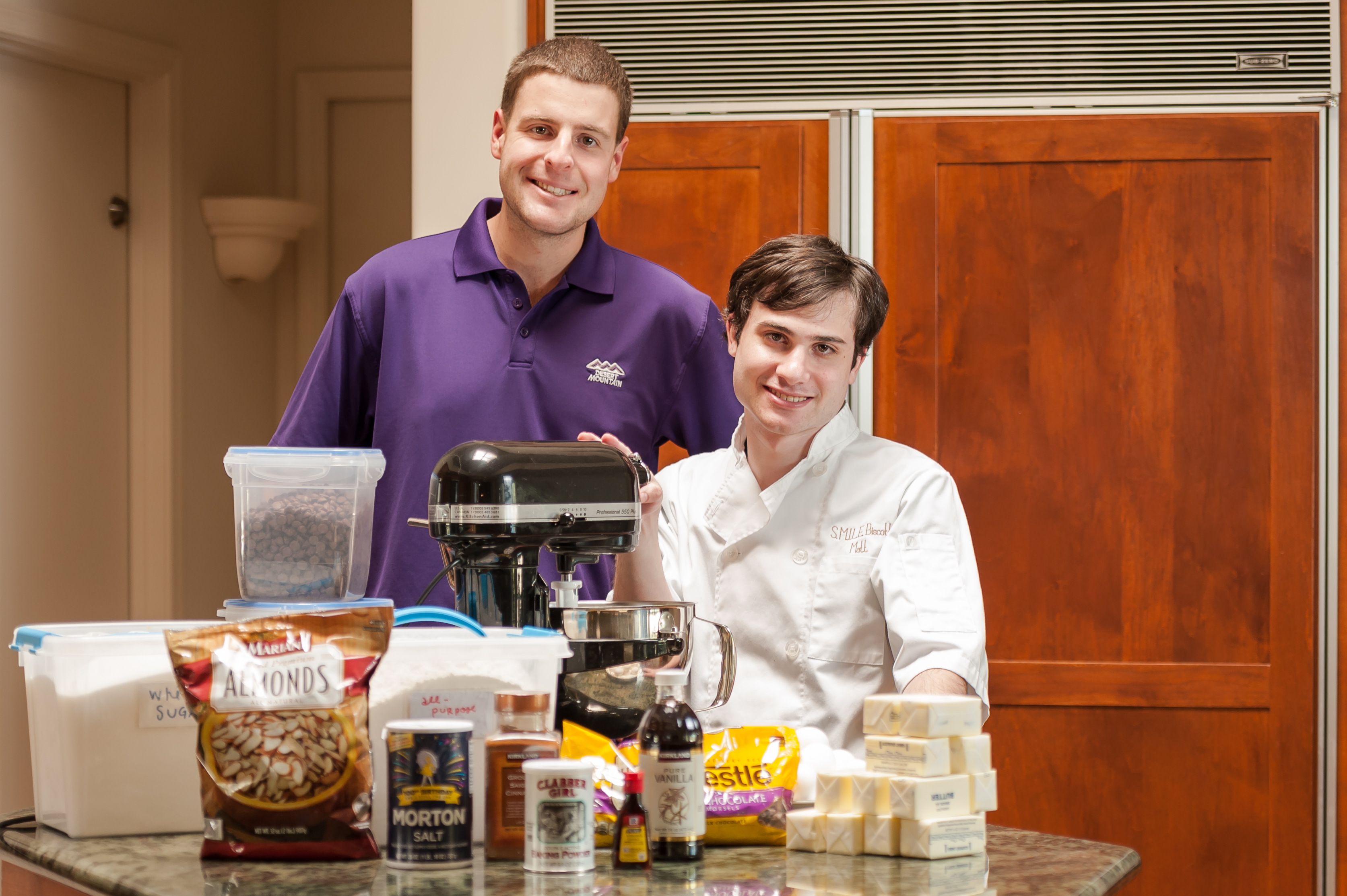 Matt (right) along with one of SMILE's other biscotti bakers