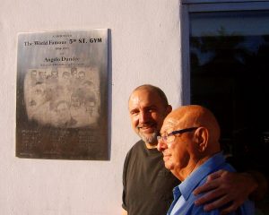 Dr. Hackie Reitman (left) stands with Angelo Dundee (right) next to a plaque honoring the 5th Street Gym